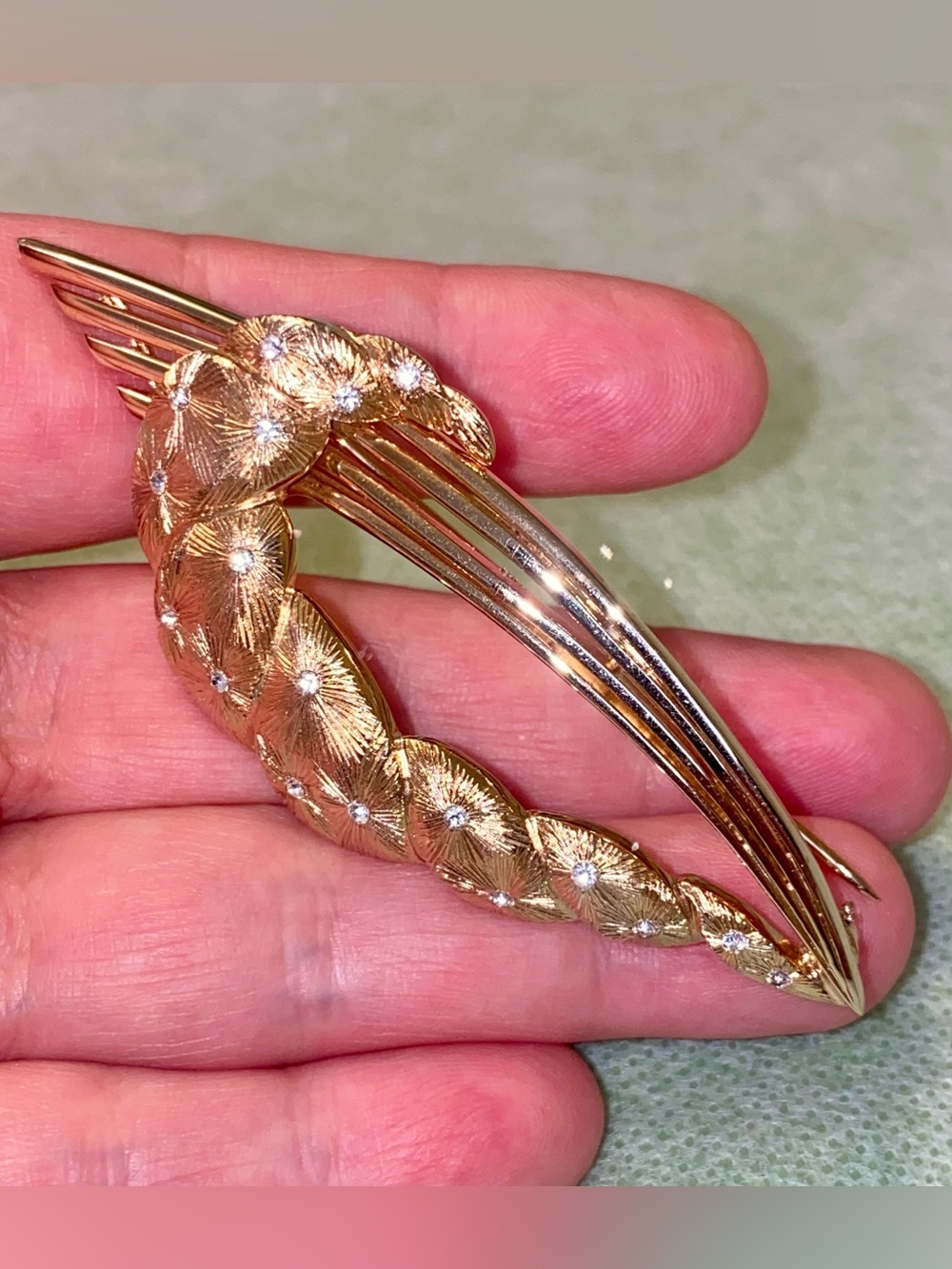 Elegant Gold-Tone Leaf Wave Brooch with Crystal Accents